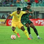 A South African player dribbles past a Super Eagles defender during their 2026 World Cup qualifier.