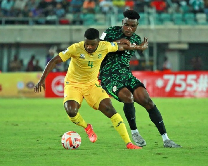 A South African player dribbles past a Super Eagles defender during their 2026 World Cup qualifier.